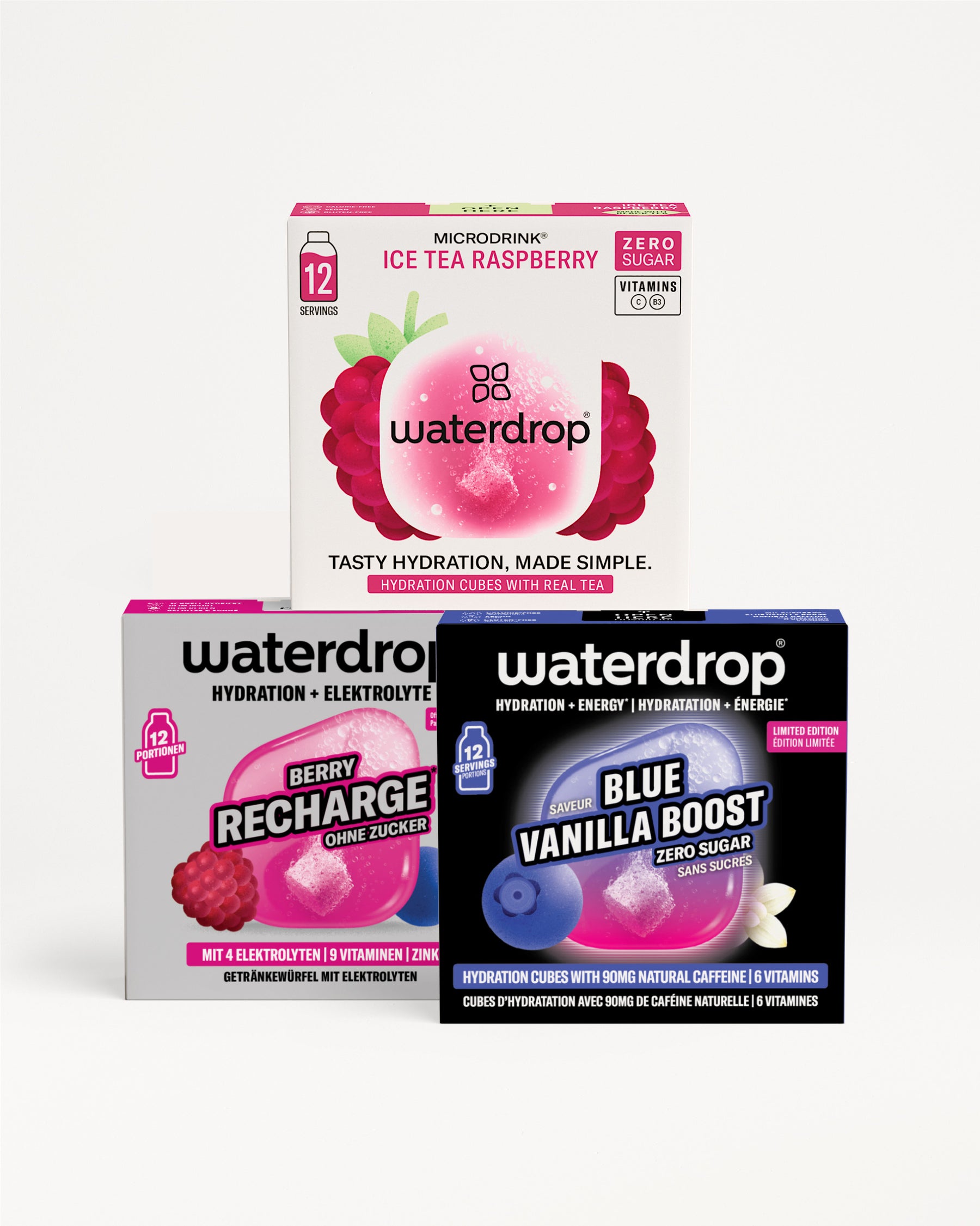 Tri kutije Waterdrop za hidrataciju složene u piramidu, sa roze, ljubičastom i plavom grafikom pakovanja.
