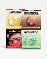 Četiri Waterdrop kutije za hidrataciju poređane u 2×2 mrežu sa četiri ukusa: Apple, Cola, Cherry Boost i Lemon Lime.