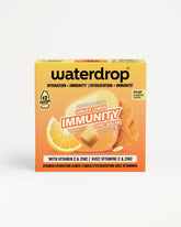 Narandžasta kutija Waterdrop imunost za imunitet sa prikazom limuna i đumbira.